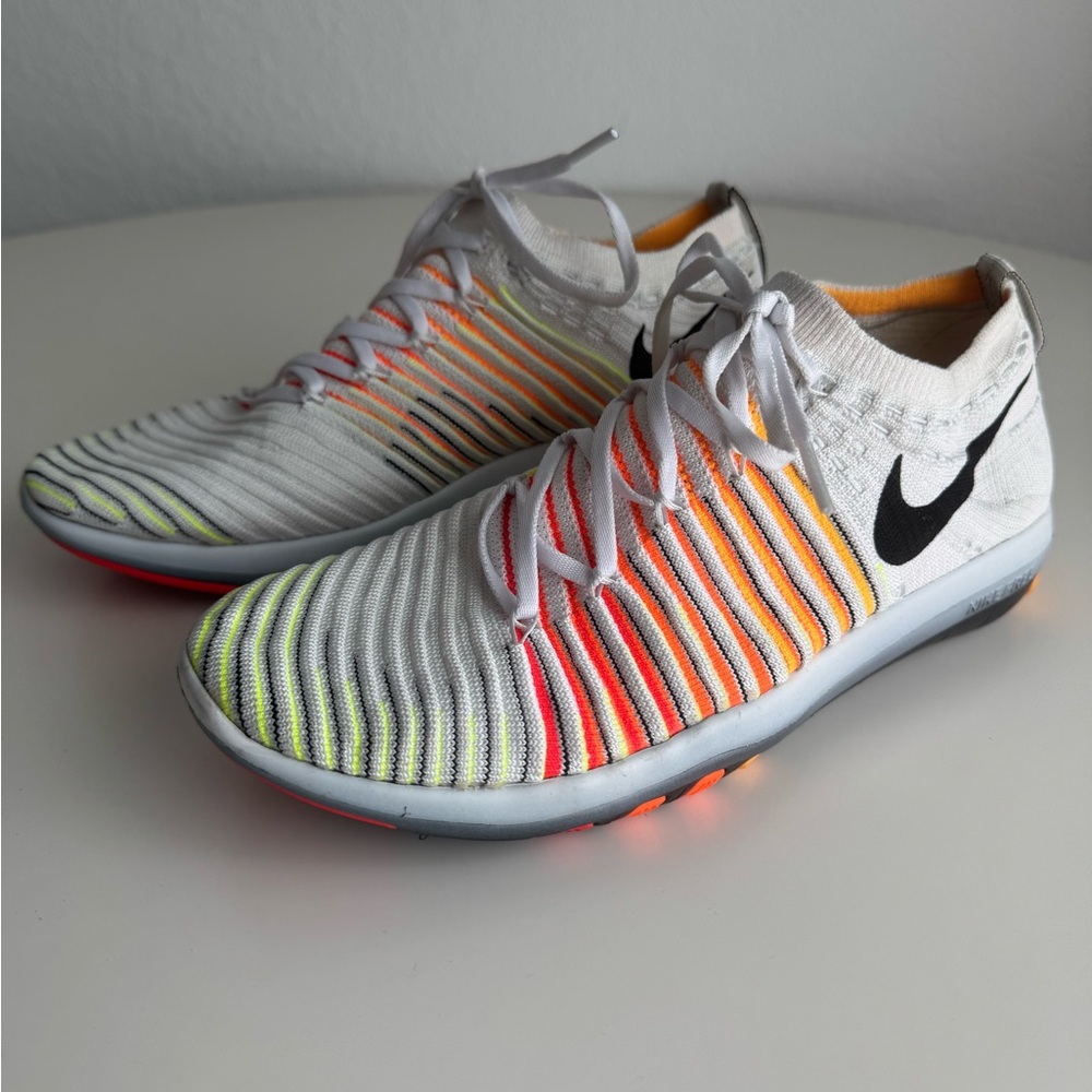 Nike White and Orange Flyknit Frees